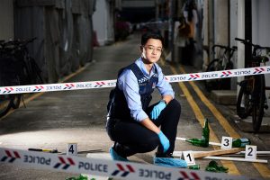 ASP Alden Tan from the Tanglin police force division at an alleyway crime scene