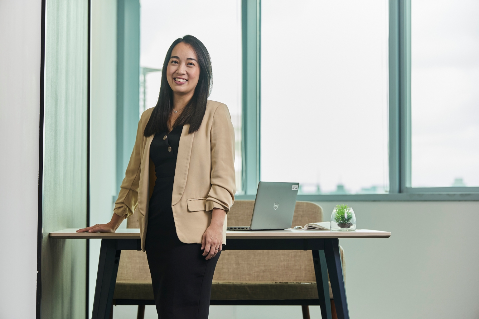 office shot of iras scholarship holder joanne tan tax director, 13 year taxation career path, lead team of 22 officers to discover dynamic nature of tax work in singapore