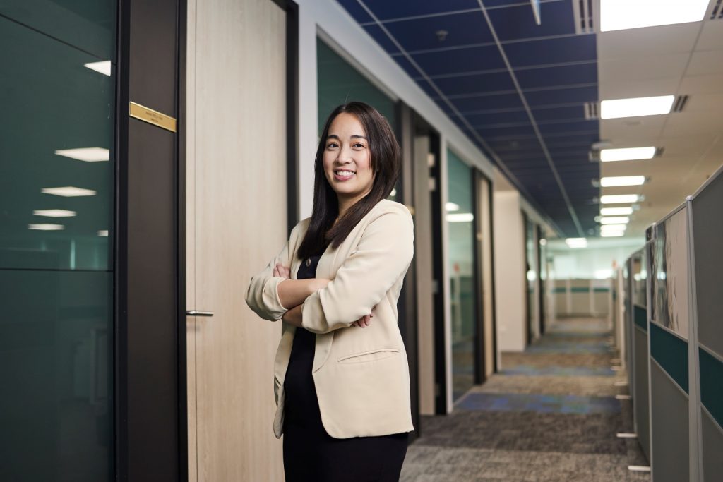 profile shot of joanne at iras, mother of two young children, ensures work life balance with professional career